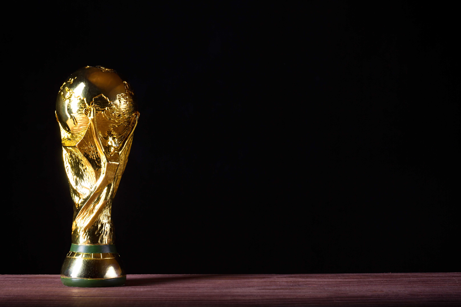 The iconic golden FIFA World Cup Trophy symbolizing football's pinnacle achievement